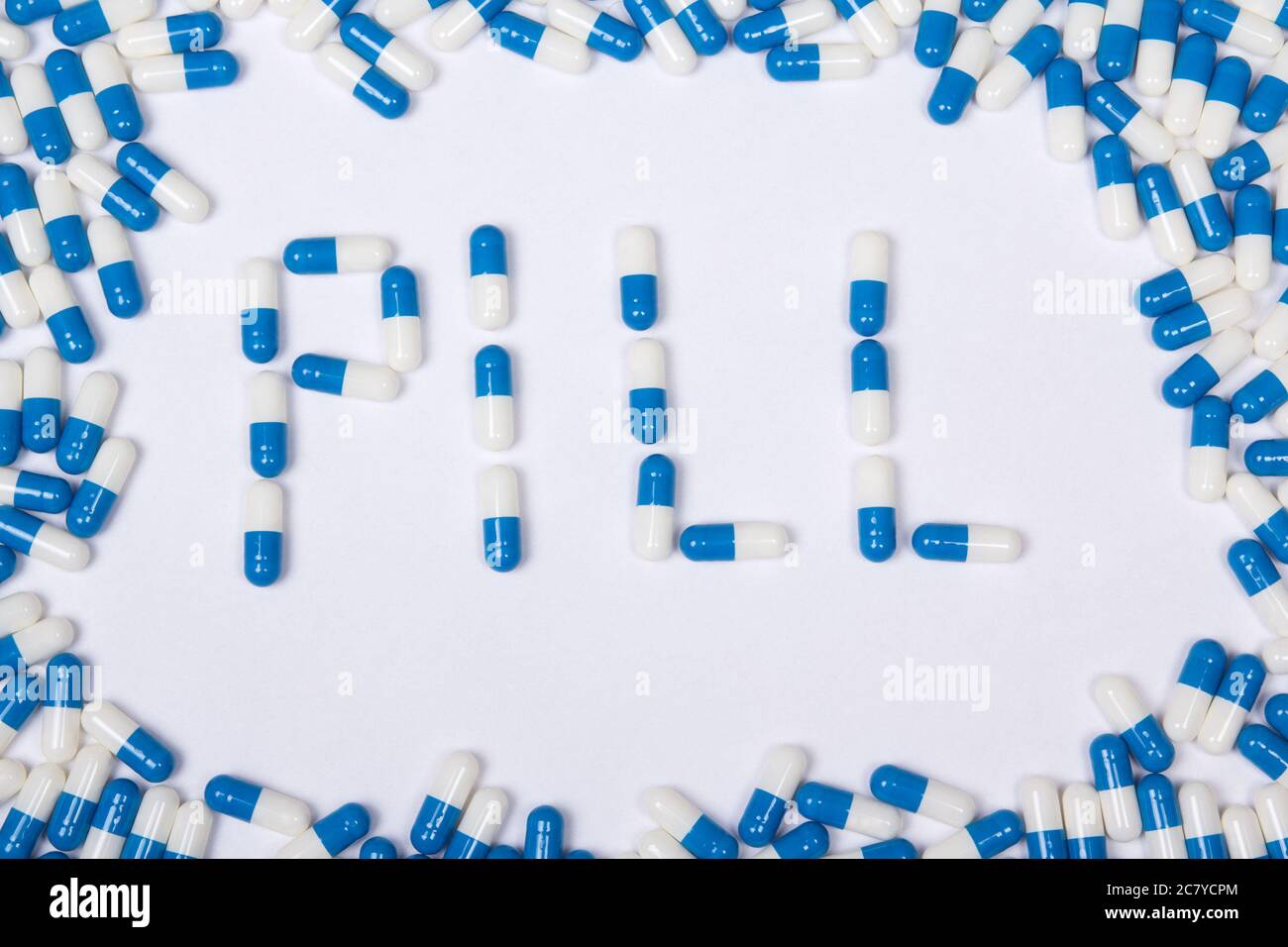 pill word text made of blue tablets, pills and capsules on white