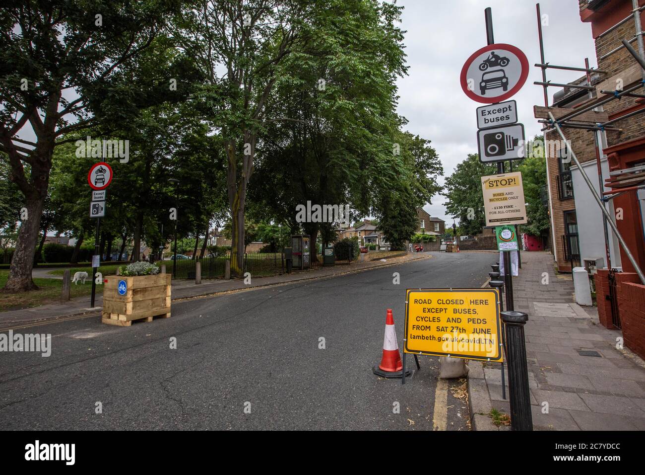 London road blocks to restrict traffic in place to create 'cycle highways' and encourage cycling & cut air pollution on Railton Road, Lambeth SE24 Stock Photo