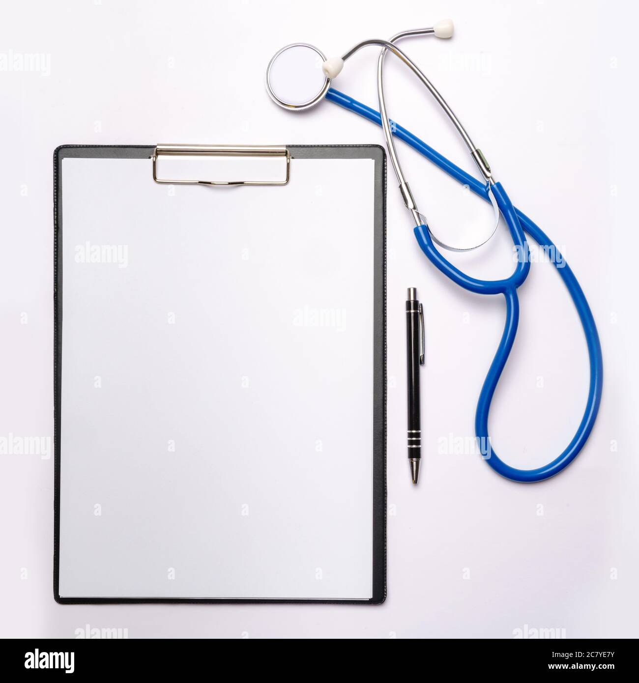 Healthcare and medical concept stethoscope and pen over