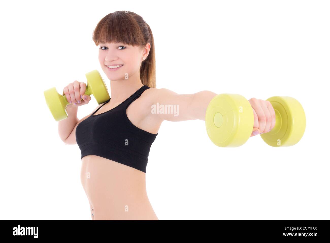 young sporty woman holding dumbbells isolated on white background Stock Photo