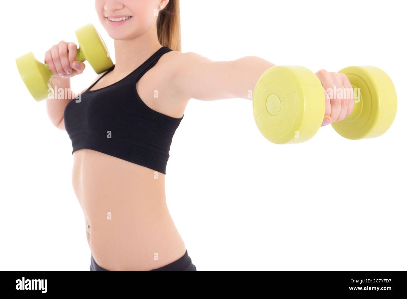 young woman holding dumbbells isolated on white background Stock Photo