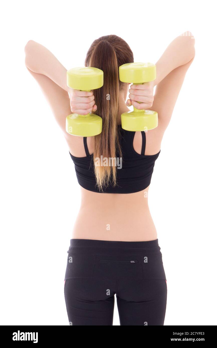 back view of young beautiful slim woman with dumbbells isolated on white background Stock Photo