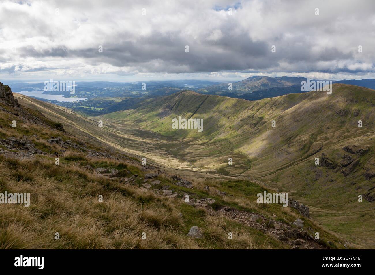 Summer view of the valley of Rydal Beck from Fairfield with Great Rigg, Heron pike and Windermere visible Stock Photo