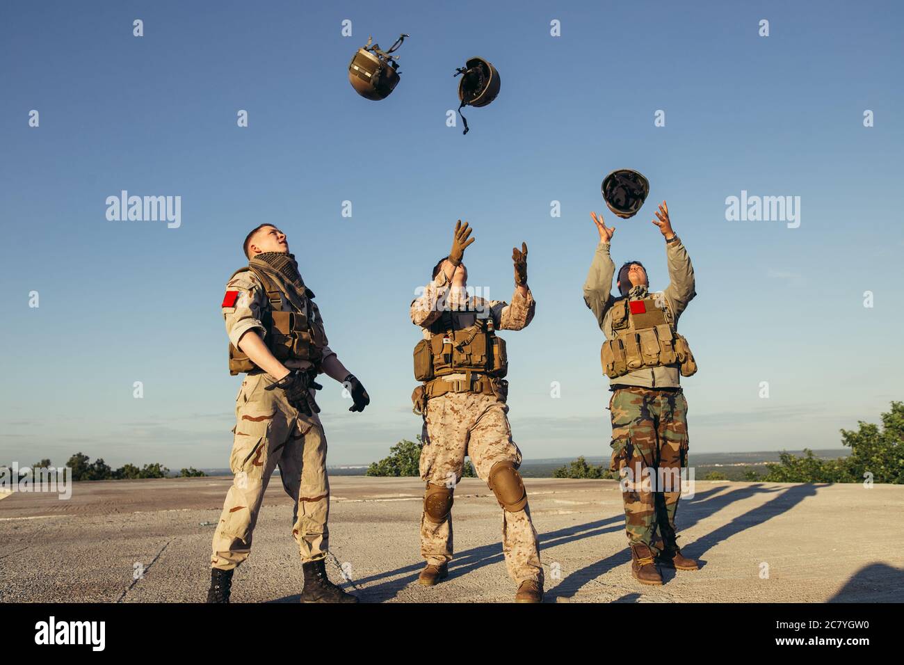 American soldiers celebrating the victory throwing hats in the air