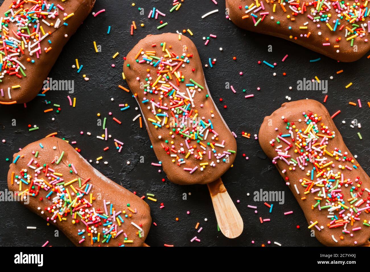 popsicle with sprinkles on a black background Stock Photo Alamy
