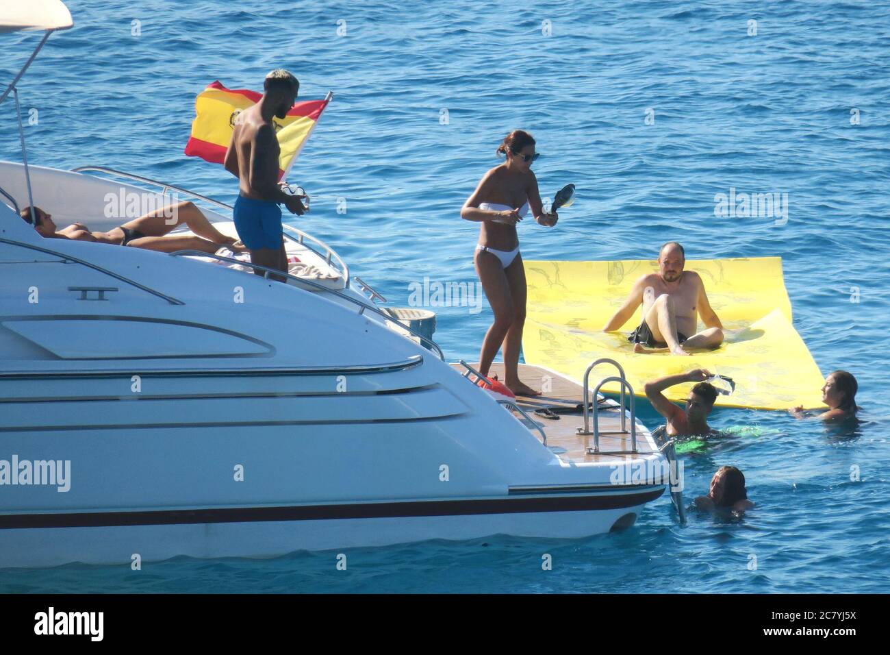 Formentera, Spain. 19th July, 2020. Tamara Gorro and Ezequiel Garay relax on the boat. Credit: Independent Photo Agency/Alamy Live News Stock Photo