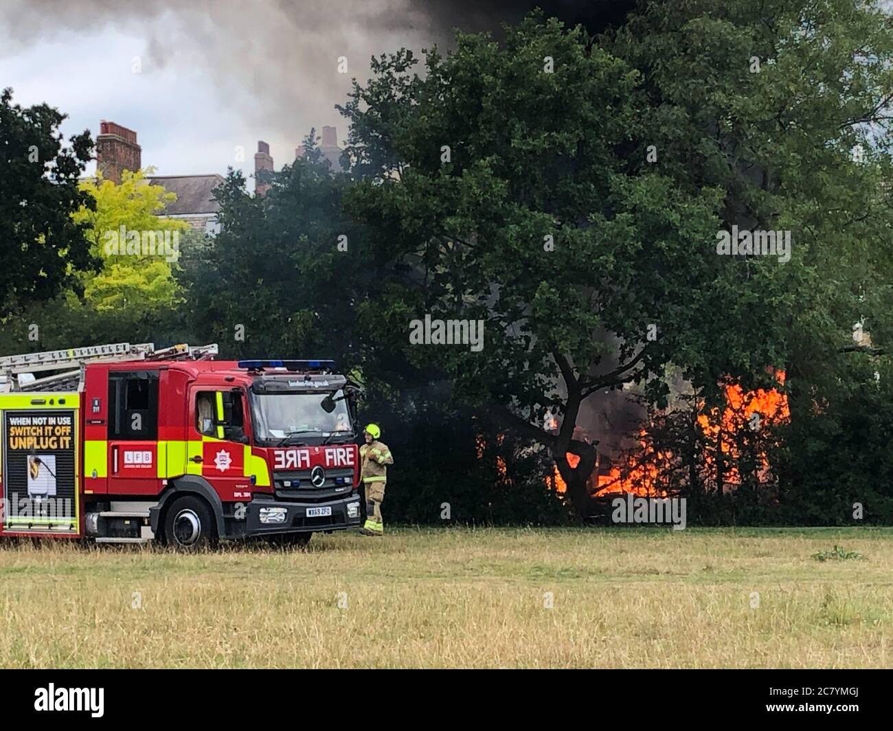 London, UK. 19th July 2020; Tooting Common Fire - Firefighters tackle promptly Credit: Jonny Abbas/Alamy Live News Stock Photo