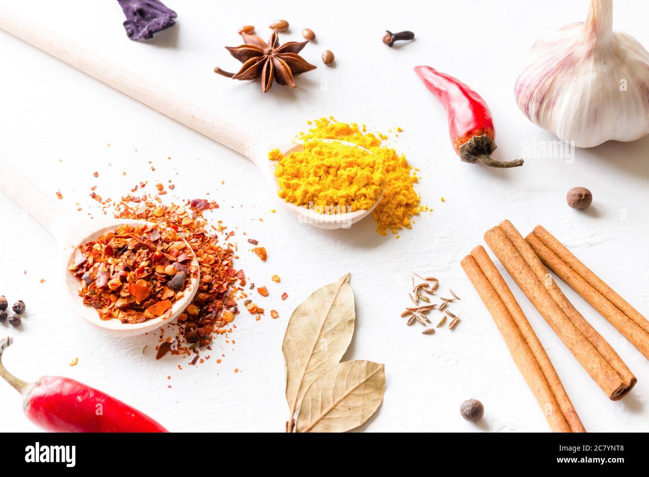 multi-colored spices and herbs on white background close-up Stock Photo