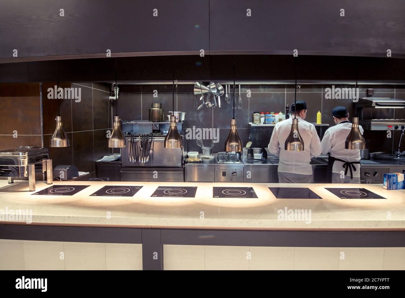 Variety of utensils on counter in commercial kitchen Stock Photo Alamy