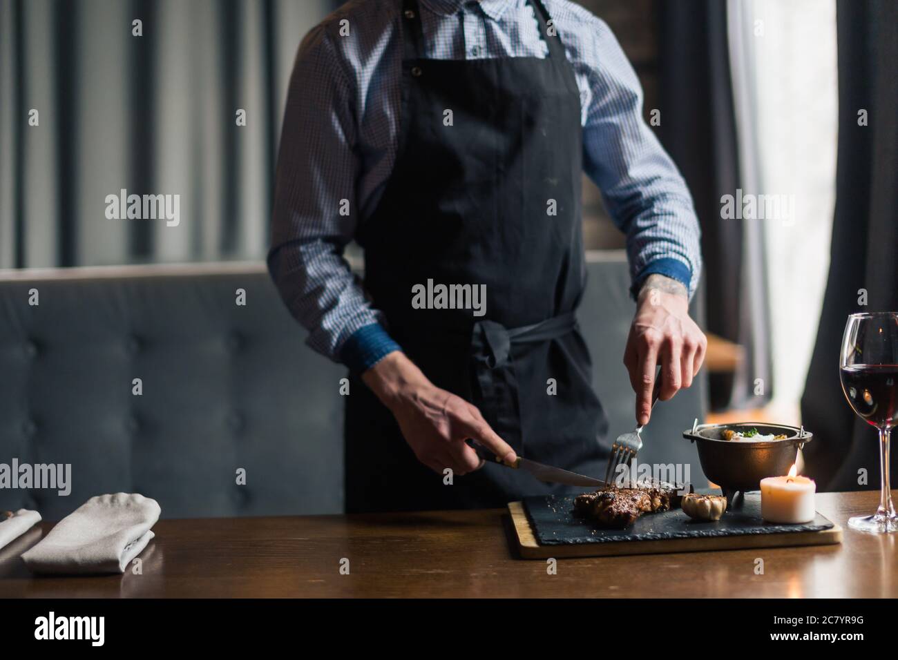 Male hands fork knife cut hi-res stock photography and images - Alamy