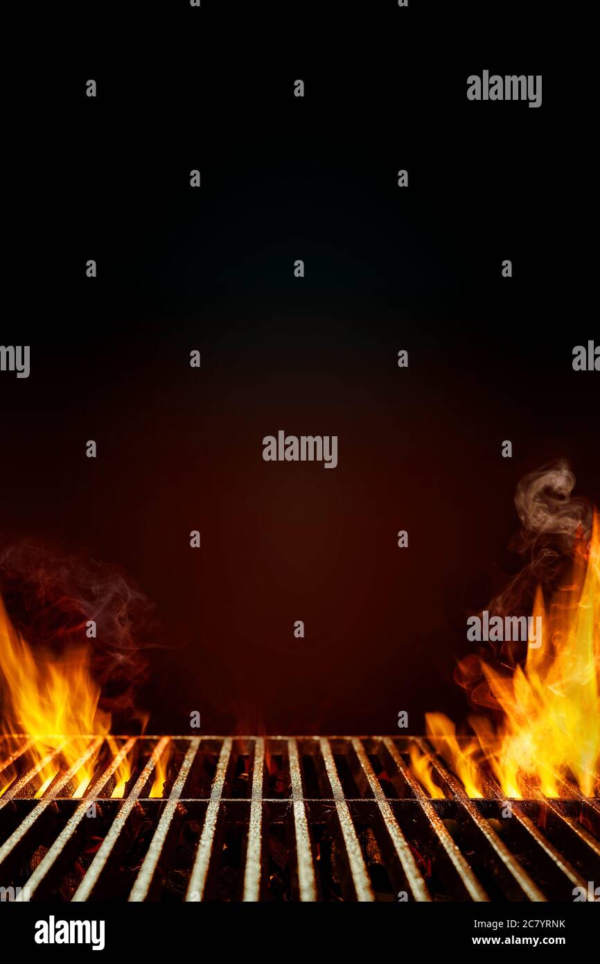 Hot empty steel barbecue BBQ grill with bright flaming fire and smoke