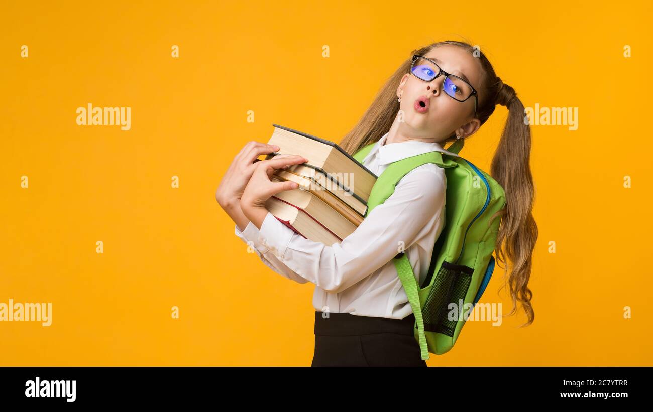 Overworked School Girl Holding Books Standing Over Yellow Background ...