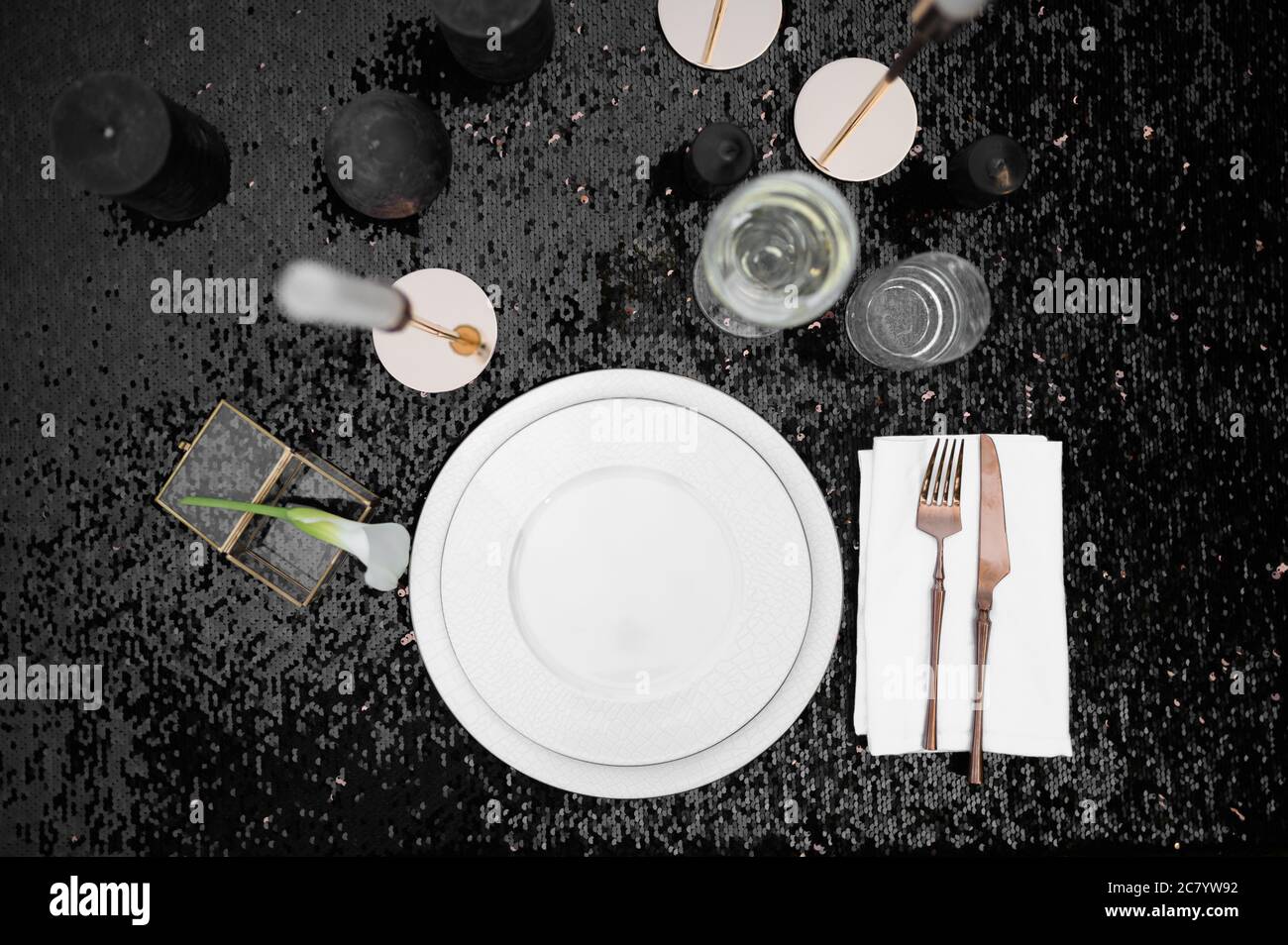 Table setting, luxury tableware on black, top view Stock Photo