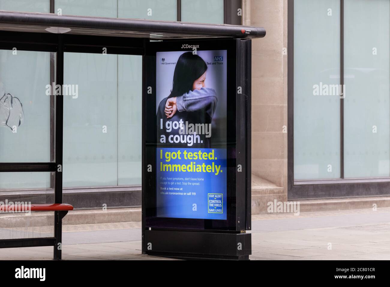 Government sponsored covid-19 coronavirus safety advert for testing on a bus stop, Westminster, London, England, UK Stock Photo