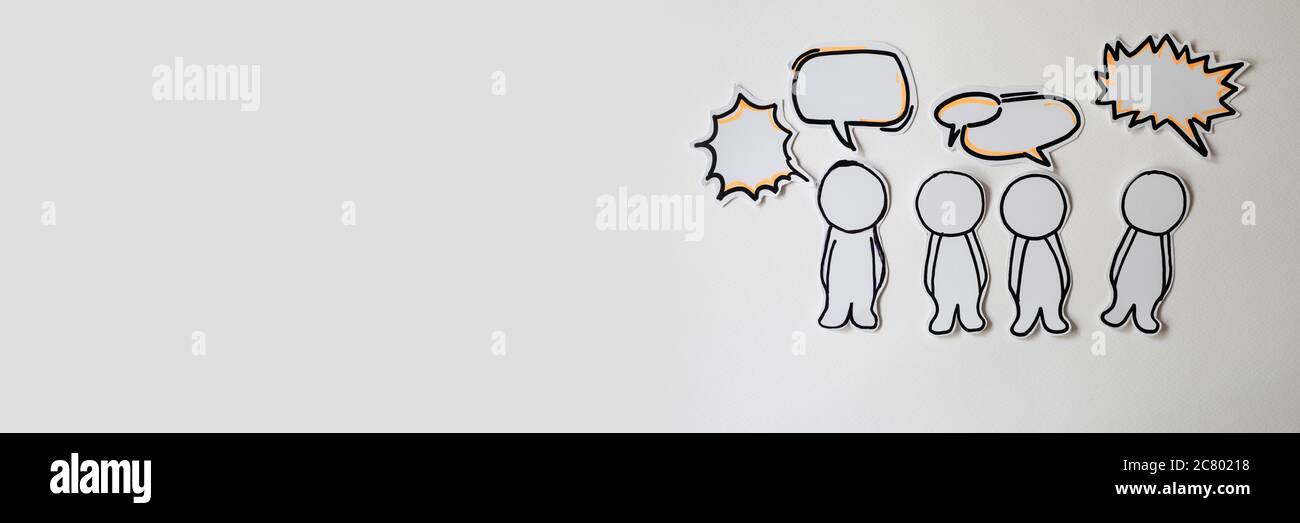Paper figures with speech bubbles on the white Stock Photo