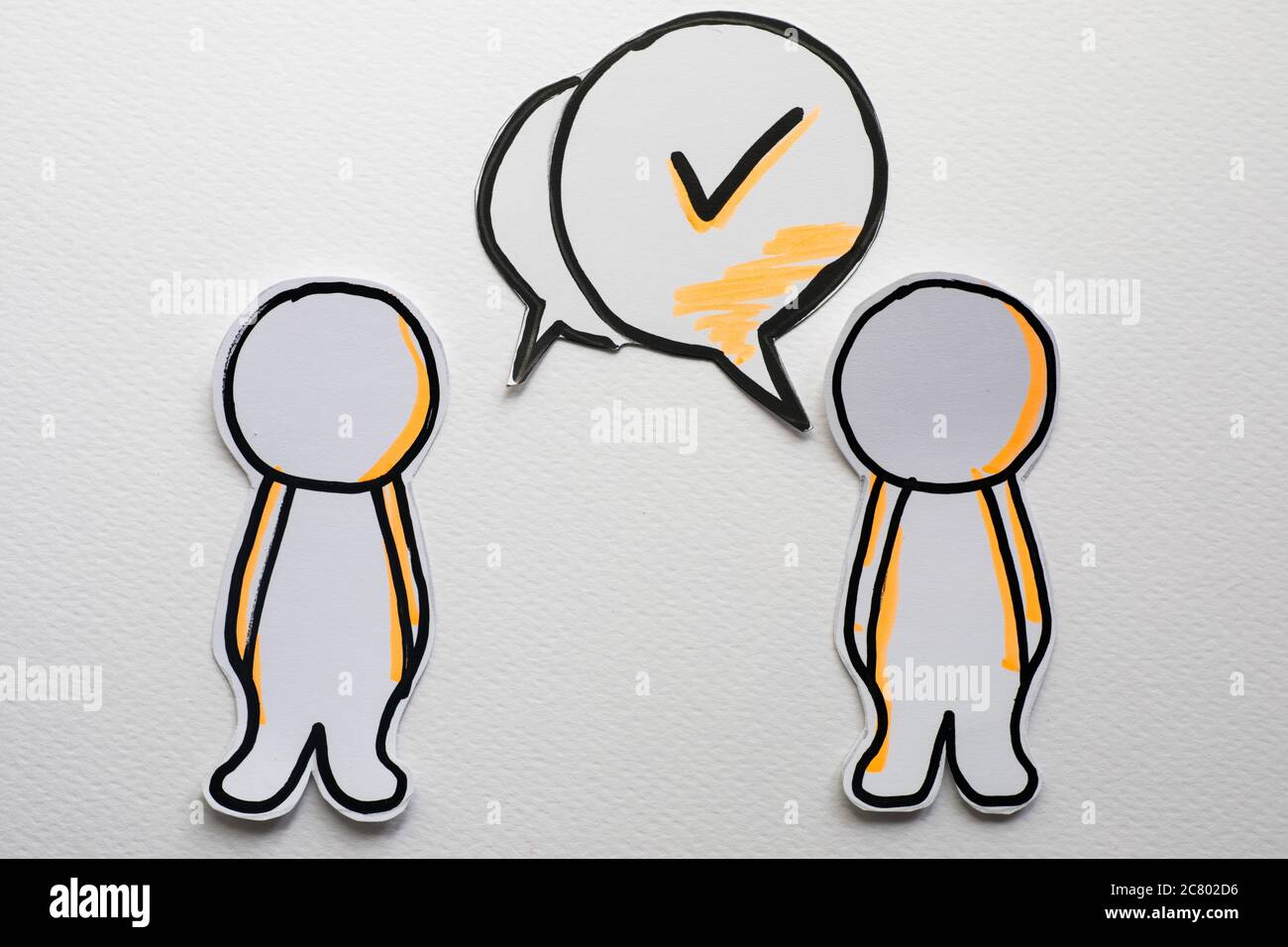 Paper figures with speech bubbles on the white Stock Photo