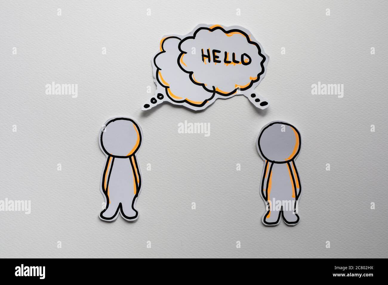 Paper figures with speech bubbles on the white Stock Photo