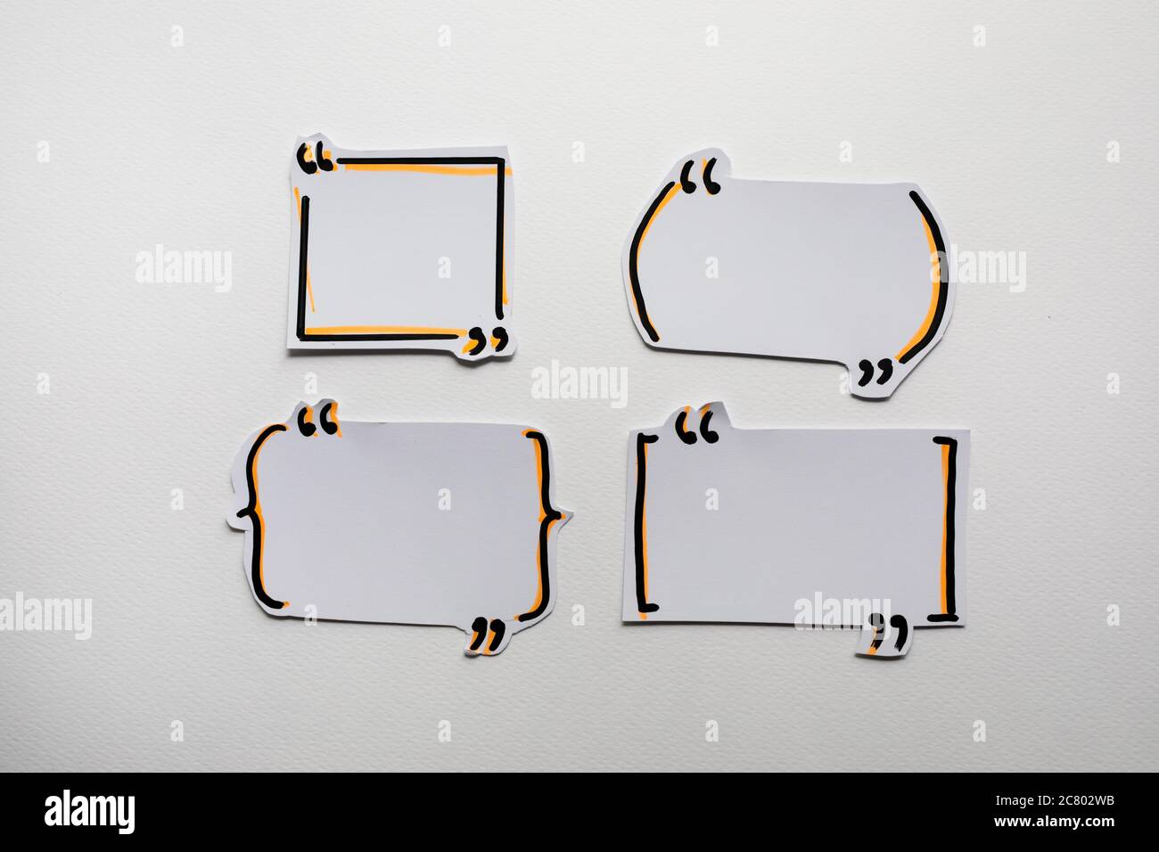 Paper speech bubbles icon on the white Stock Photo
