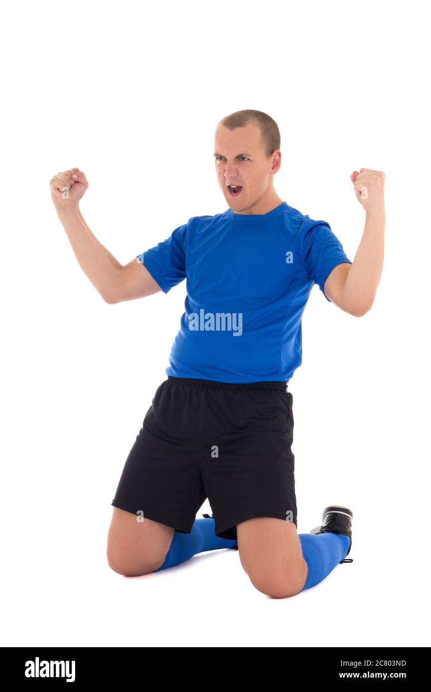 kneeling soccer player in blue uniform celebrating goal on white background Stock Photo