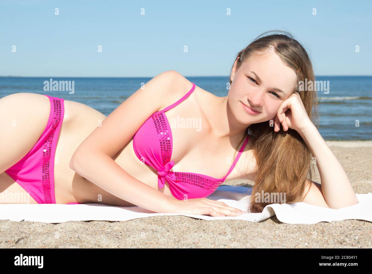beautiful teenage girl in pink bikini on the beach Stock Photo - Alamy