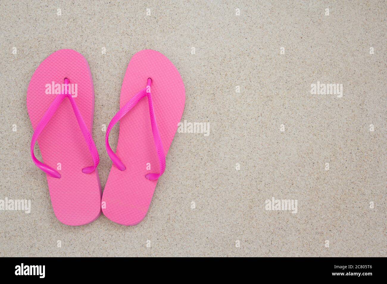 pink flip flops on the white sands of a tropical beach Stock Photo - Alamy