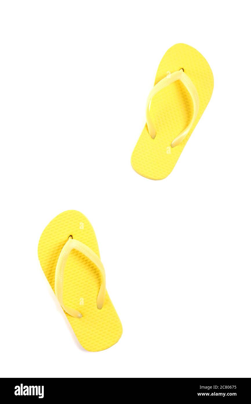 yellow flip flops isolated on white background Stock Photo - Alamy