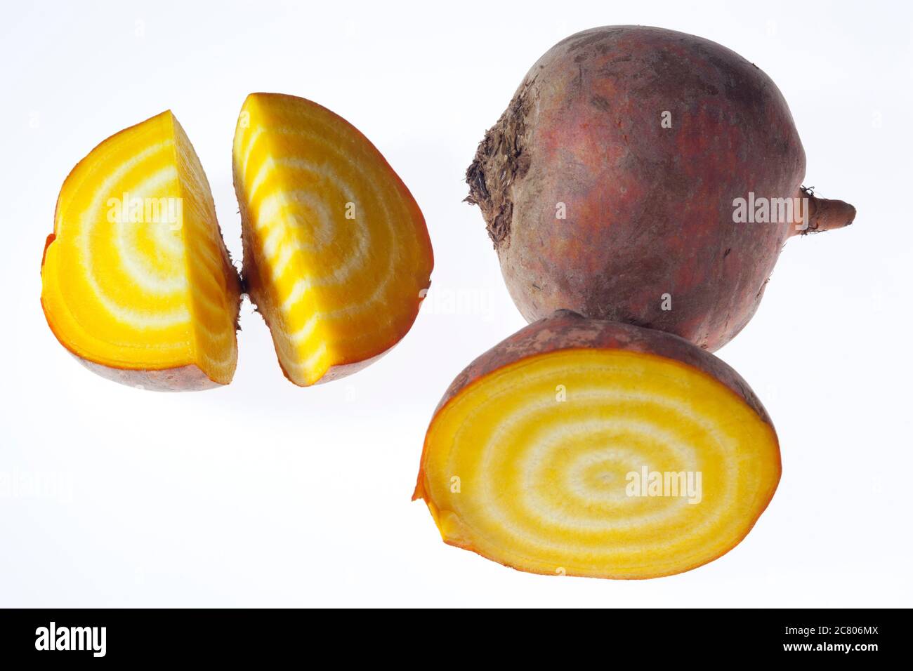 A freshly cut open Golden Yellow striped beetroot on a white light box background Stock Photo