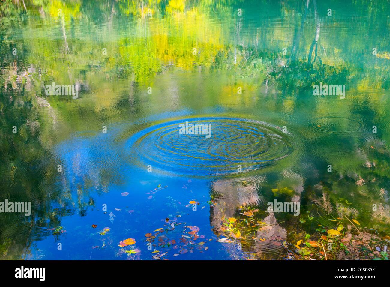 Ripples and reflections on water. Stock Photo
