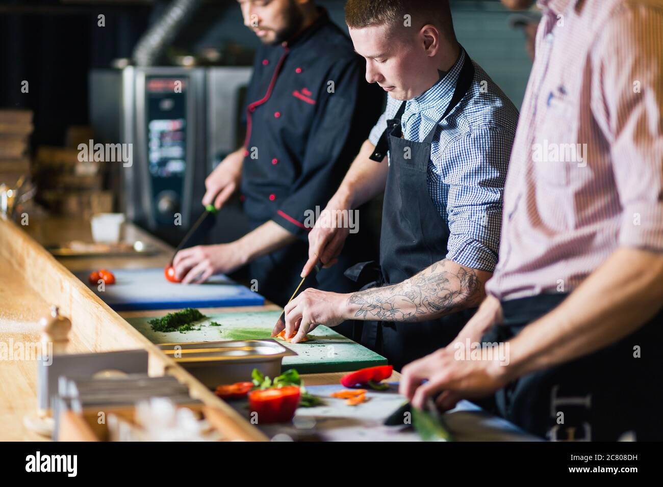 male cooks preparing sushi in the restaurant kitchen Stock Photo - Alamy