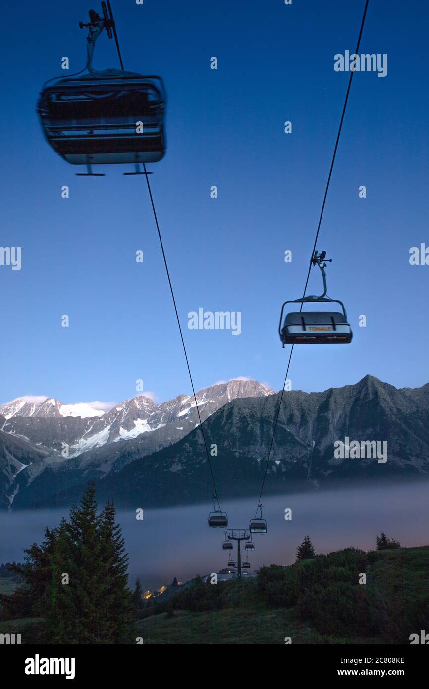 ski lifts at sunset, Tonale Est, Trentino, Italy Stock Photo
