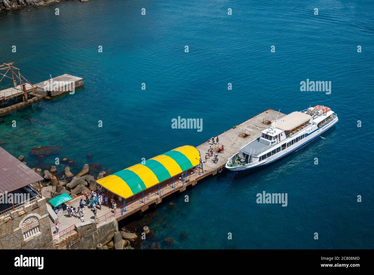 Gaspra, Crimea - July 6, 2019. Tourist ship near the sea pier Stock Photo