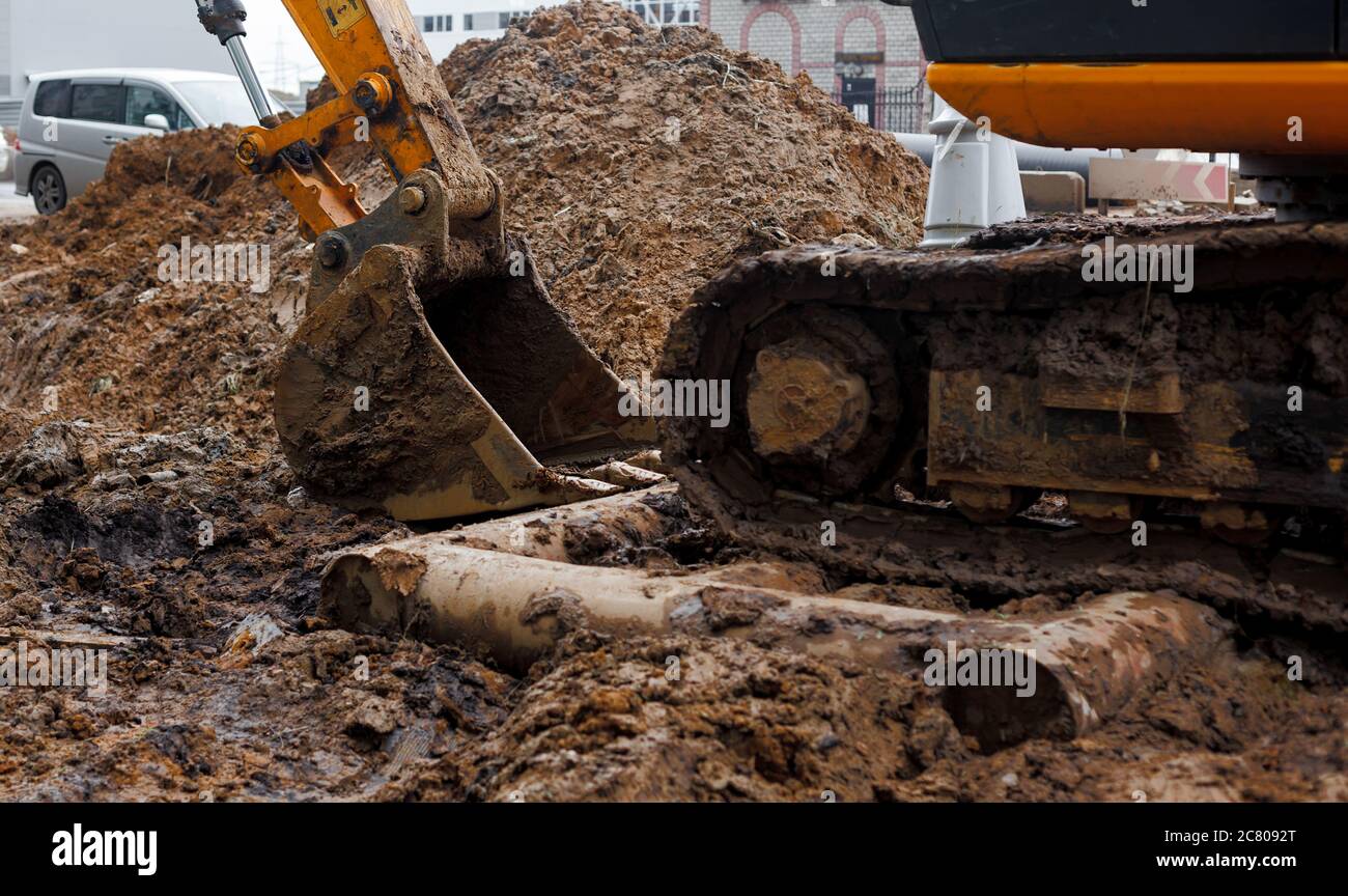 Dirty excavator bucket in mud on the construction site Stock Photo Alamy