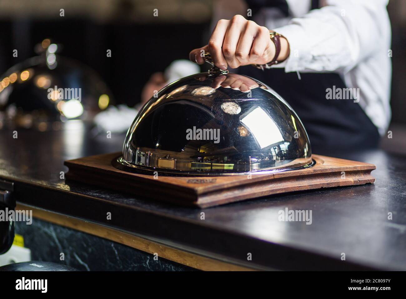 Waiter carrying silver tray hi-res stock photography and images - Alamy