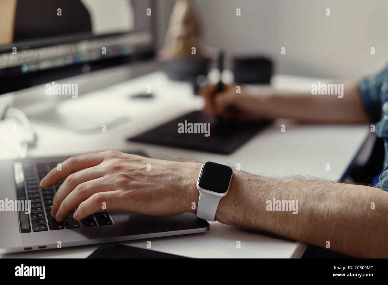 Graphic Designer working hands with interactive pen display, digital Drawing tablet and Pen. Concept of young people works mobile devices. Stock Photo