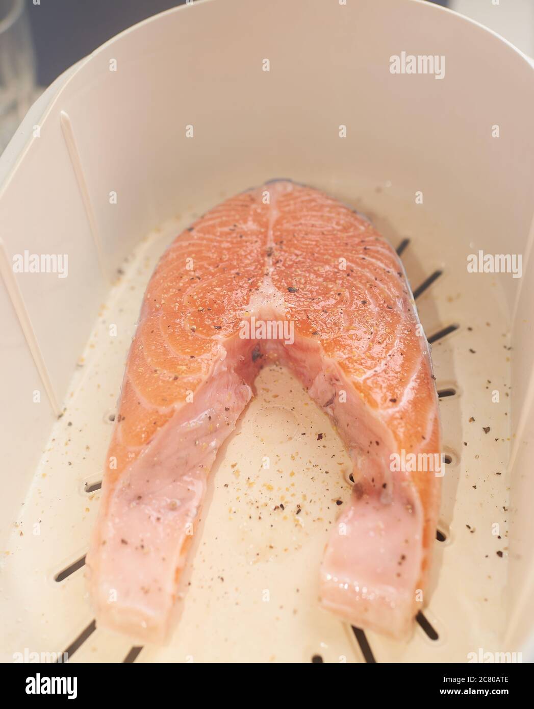 Cooking process, salmon in a double boiler, steamed. Stock Photo