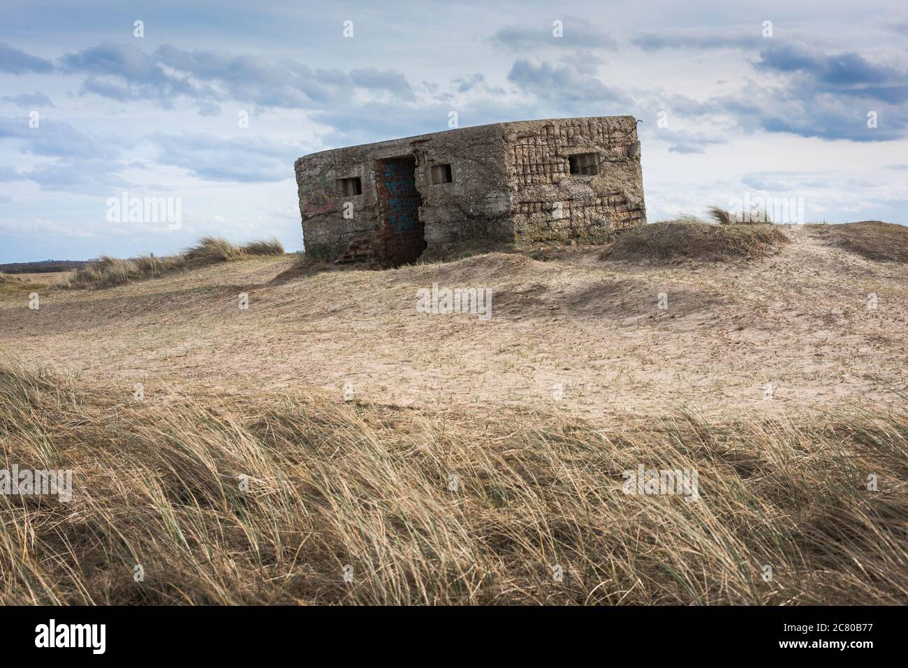 Pillbox UK, view of a derelict Type 24 WWll pillbox sited on dunes near Horsey on the East Norfolk coast, England, UK Stock Photo