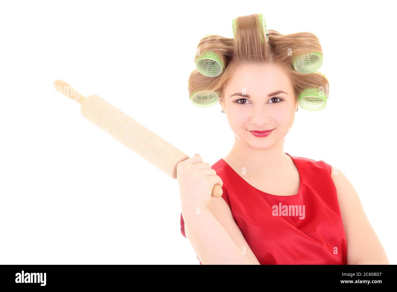housewife with roller-pin and hair curlers over white Stock Photo