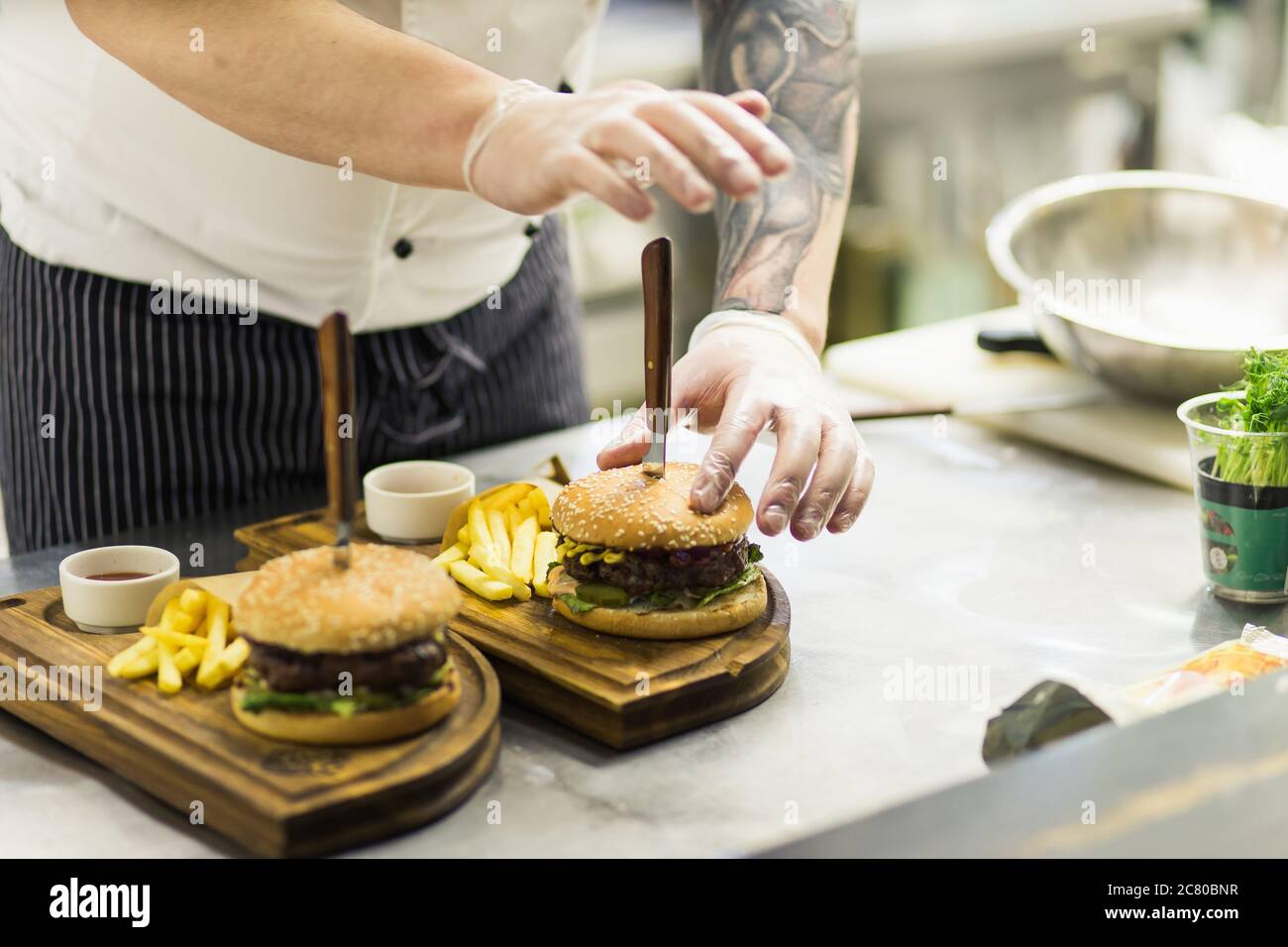 Two mouthwatering, delicious homemade burger used to chop beef. on the wooden table. The