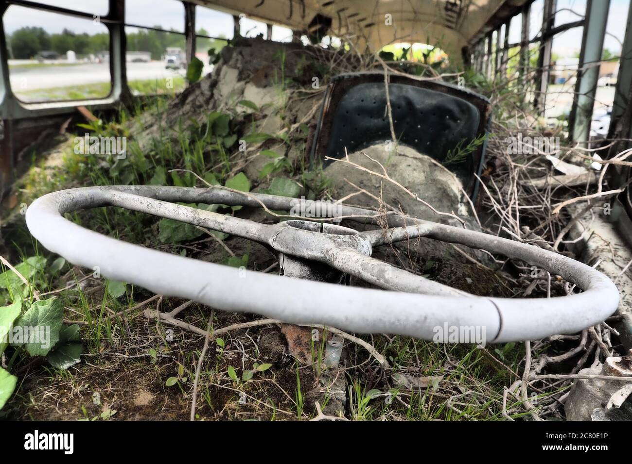 Closeup of the ruined and abandoned bus in a field Stock Photo - Alamy