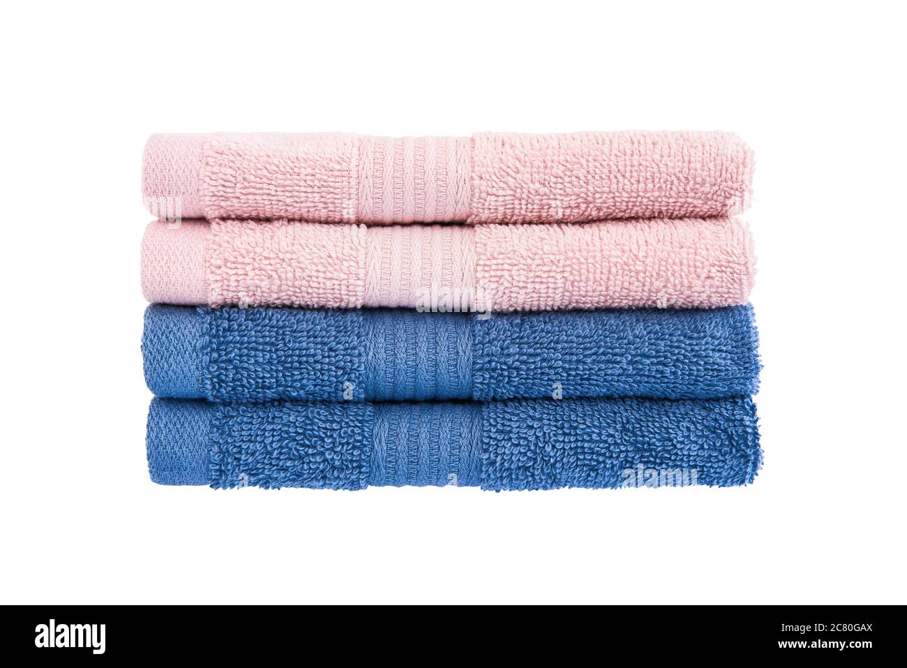 Pink and blue bath towels in stack isolated over white background with clipping path. Stock Photo