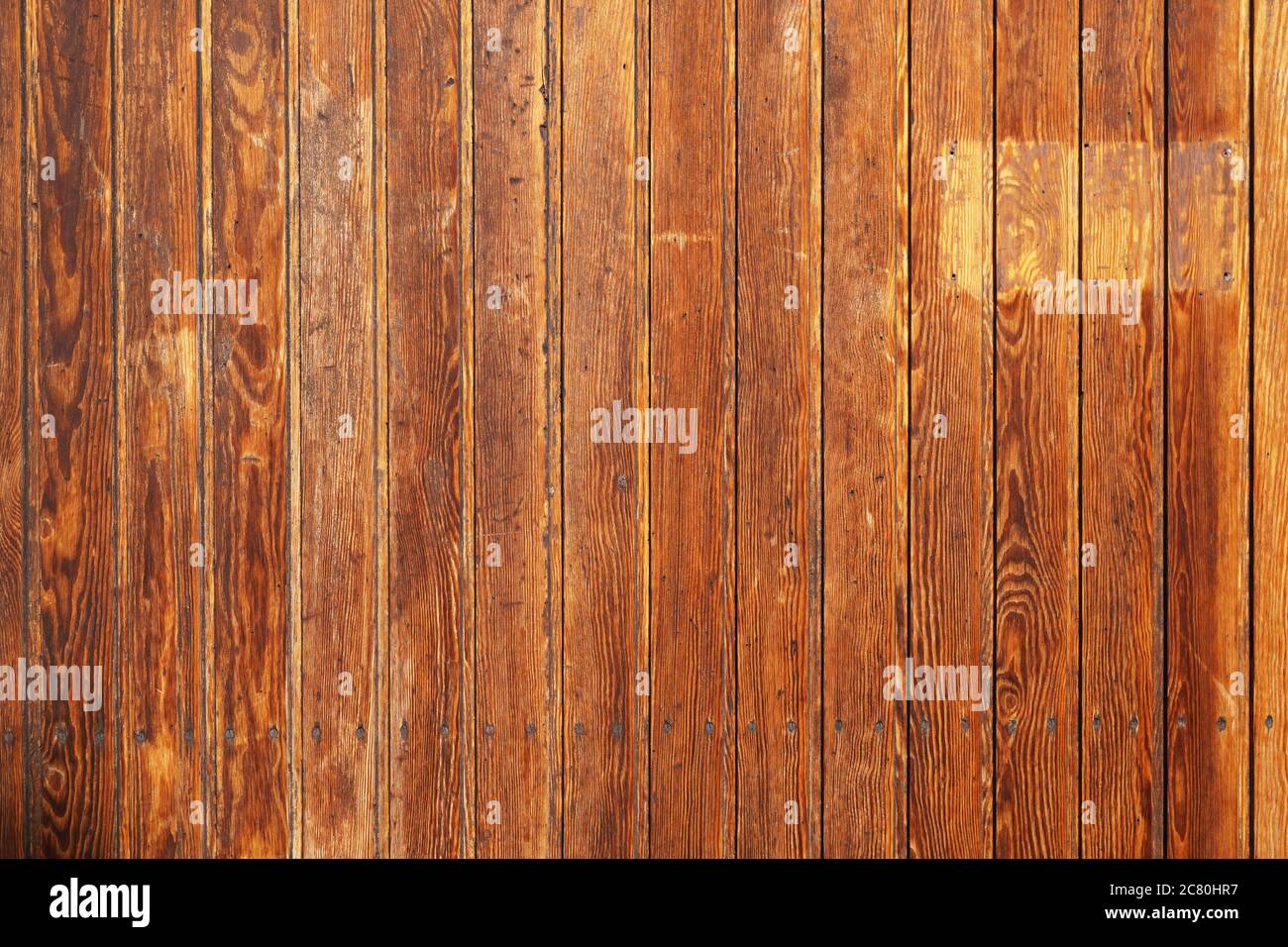 old rustic wood paneling background with vertical wooden boards or planks Stock Photo