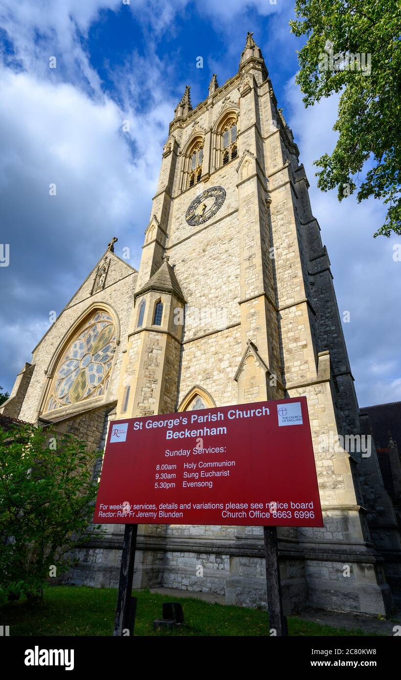 Beckenham (Greater London), Kent, UK. St George's Church in Beckenham with square church tower, circular stained glass window and sign. Stock Photo