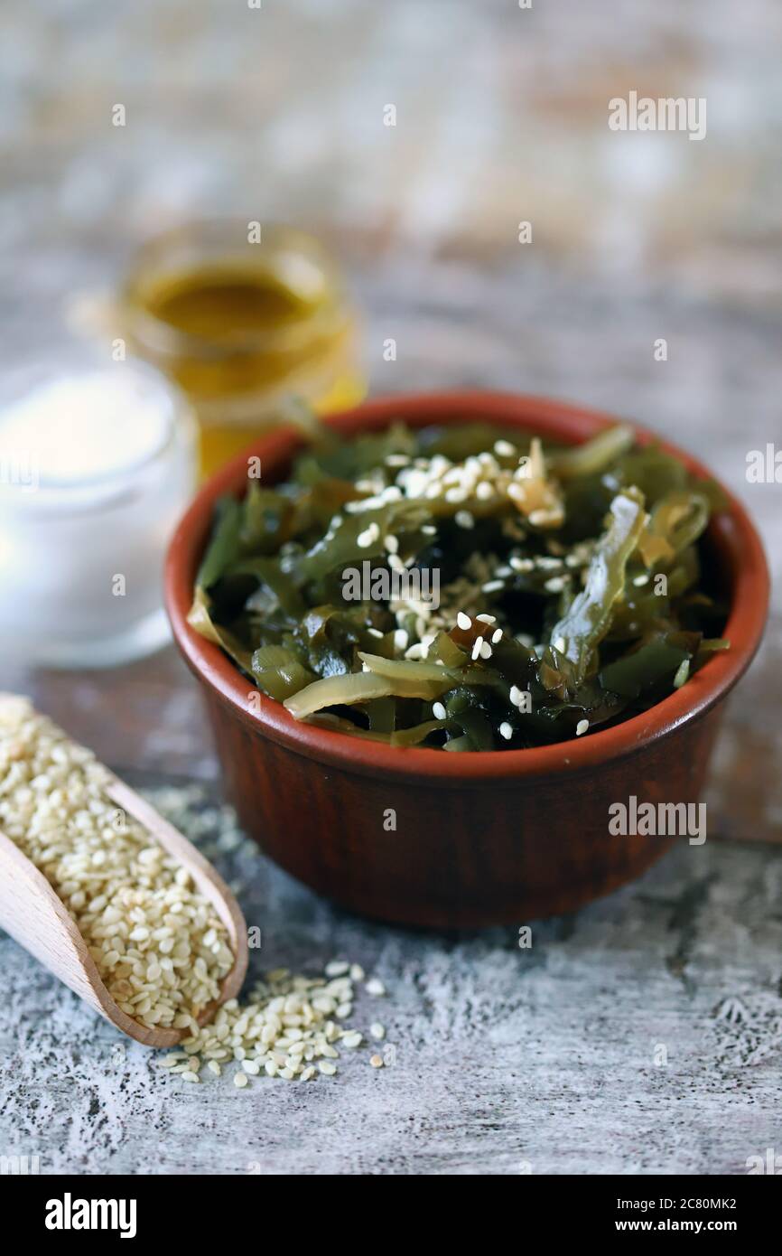 Sea kale with sesame seeds and olive oil. Healthy seafood. Omega 3