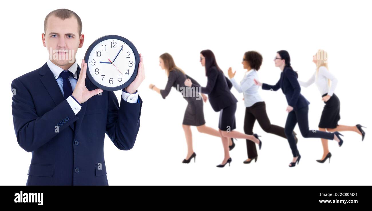 deadline concept - young businessman holding office clock and running people isolated on white background Stock Photo