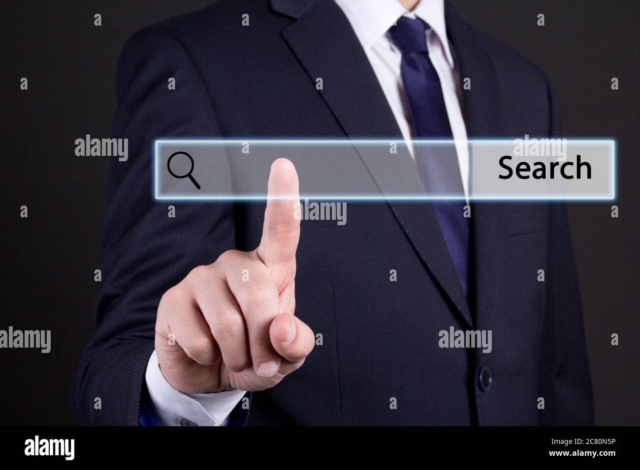 business man clicking internet search page on computer touch screen Stock Photo