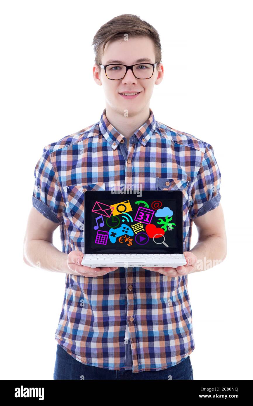 portrait of teenage boy showing laptop with media icons and ...