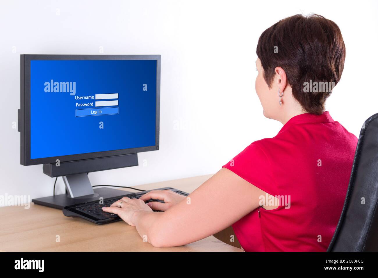 businesswoman using pc with login screen in office Stock Photo