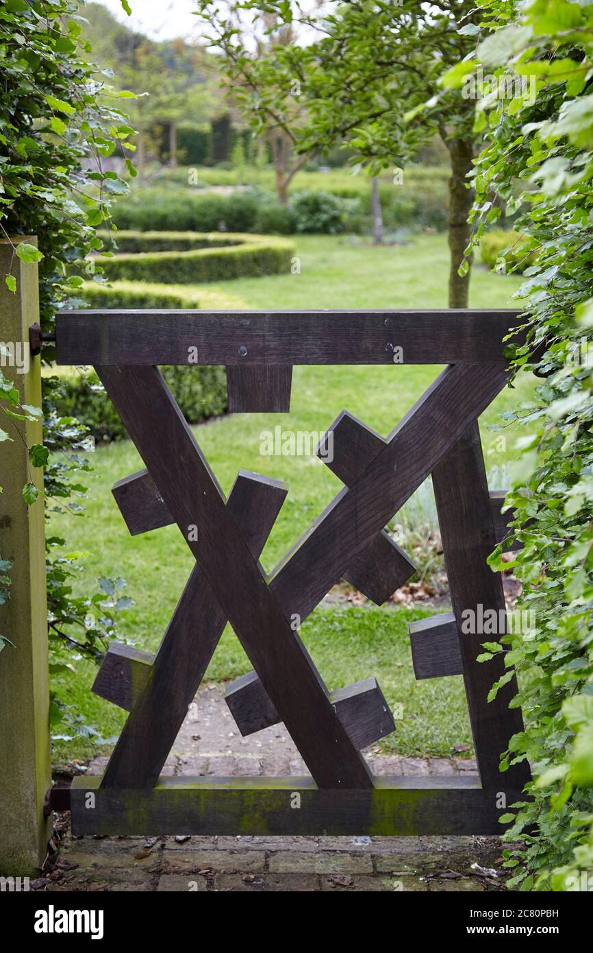 Contemporary wooden gate in the Walled Garden of the stately Regency home Scampston Hall in North Yorkshire Stock Photo