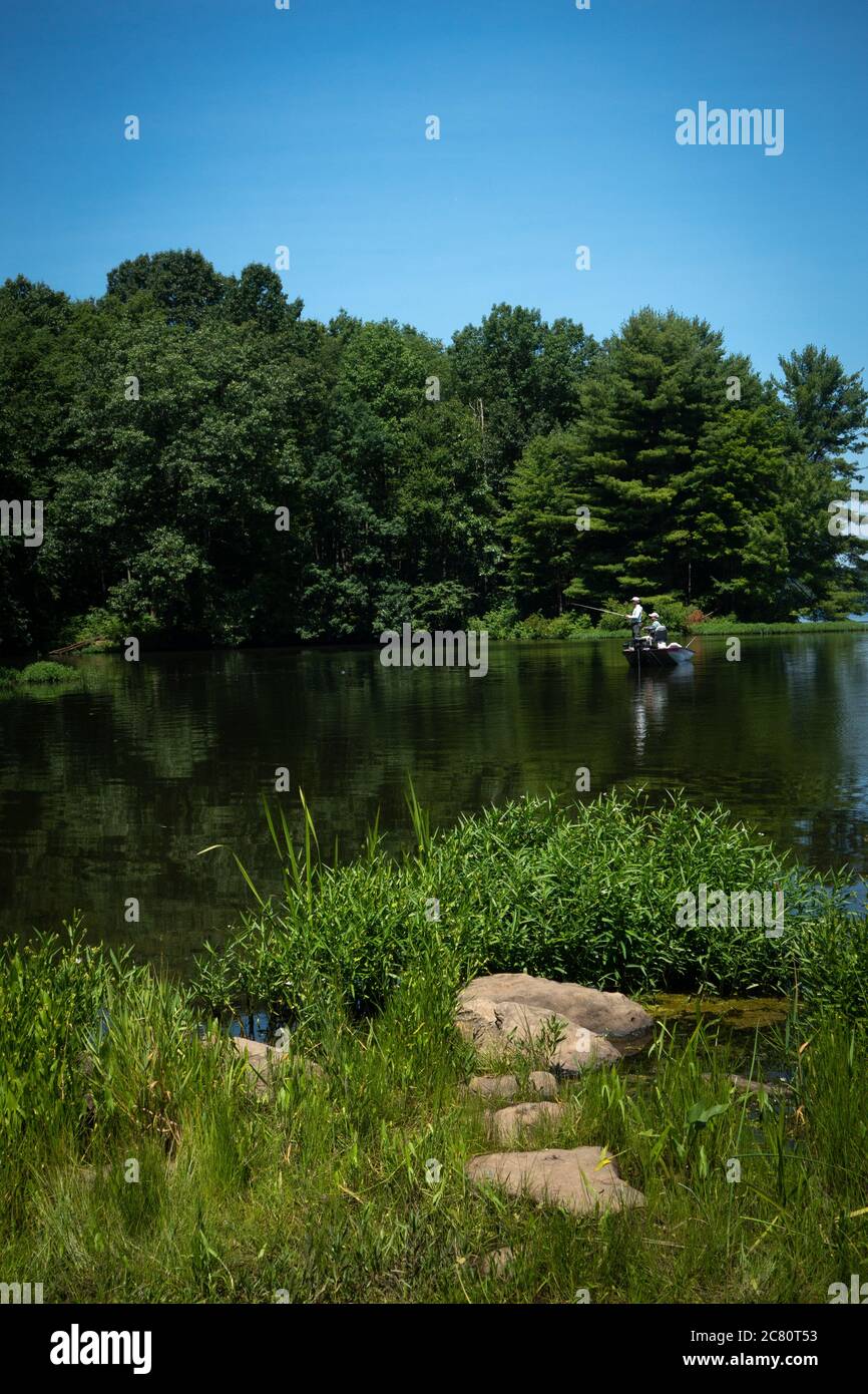 Two men fishing in a fishing boat on Lake Wilhelm, Maurice K. Goddard