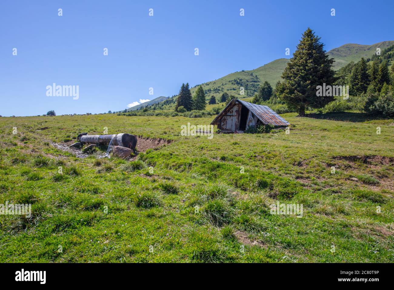 a hut in the mountain countryside, Tonale Est, Trentino, Italy Stock Photo
